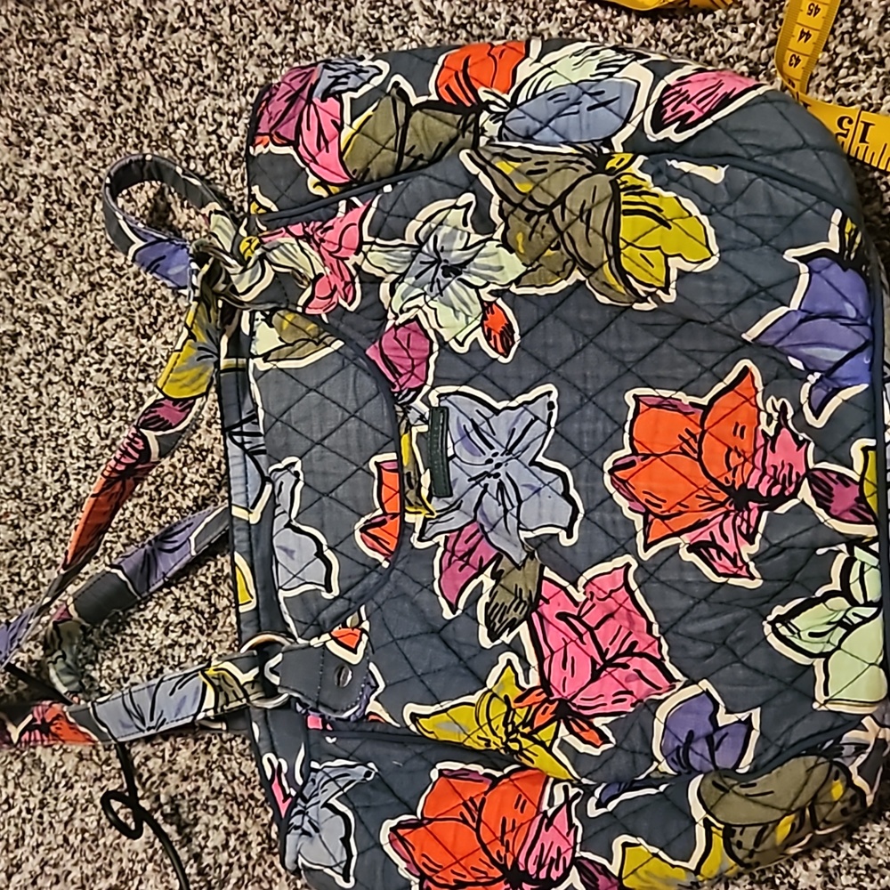 Vera Bradley purse. Dark blue with pink, blue&purple flowers. Has dots on inside
